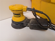 This DEWALT 3.0-Amp sander operates at 12,000 OPM to provide a smooth, swirl-free finish on wood, metal, and plastic. It features a textured anti-slip top grip, a dust-sealed switch to prevent internal contamination, and a high-capacity dust bag with a bu