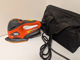 This 1.25-Amp detail sander operates at 11,000 OPM, utilizing a pointed base to access corners and tight spaces. The MS700K features a secondary "Mega" handle for improved two-handed control during polishing or heavy material removal. It includes a built-